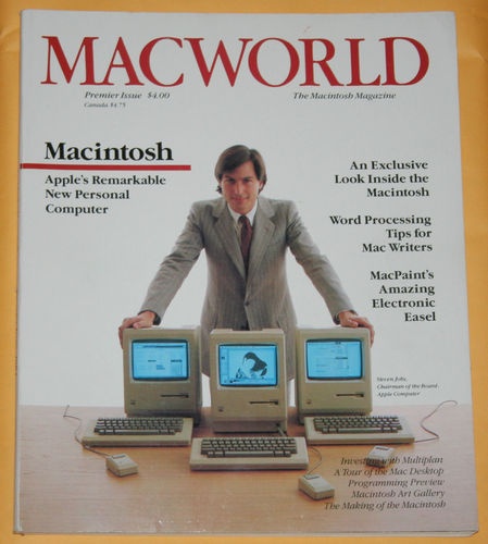 A young Steve Jobs with the first Macintosh.